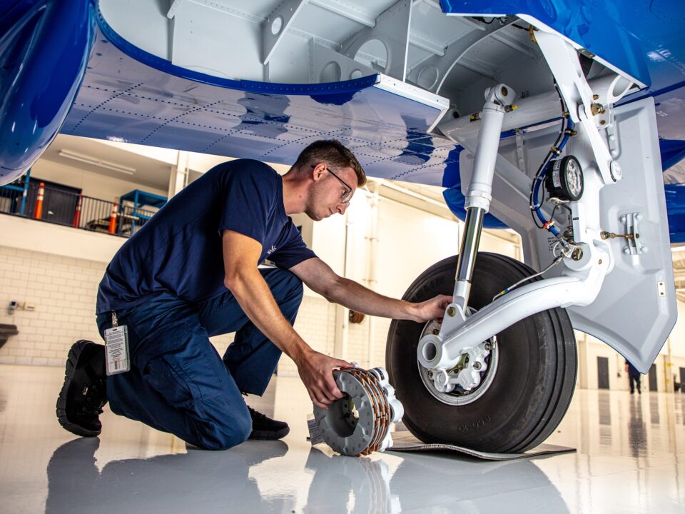 Atlas Aircraft Center Mechanic Repairing Plane